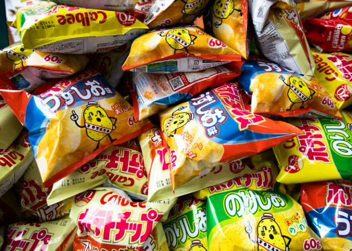 A pile of Calbee Chips, showing off all different kinds of flavors.